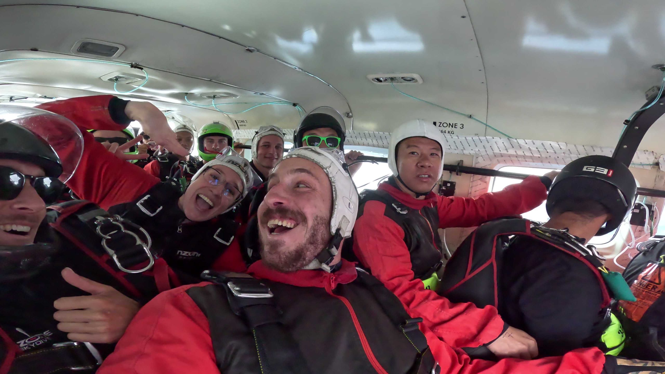 Group in plane before skydiving in Queenstown, New Zealand