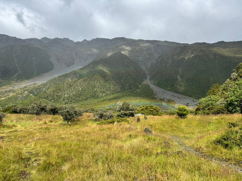 A low rainbow in White Horse Hill Campground in Aoraki / Mount Cook, New Zealand