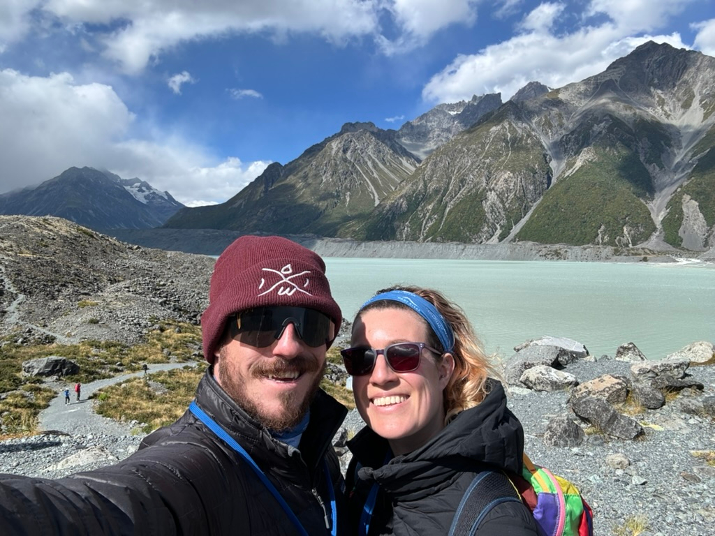 Couple in front of Tasman Lake in New Zealand