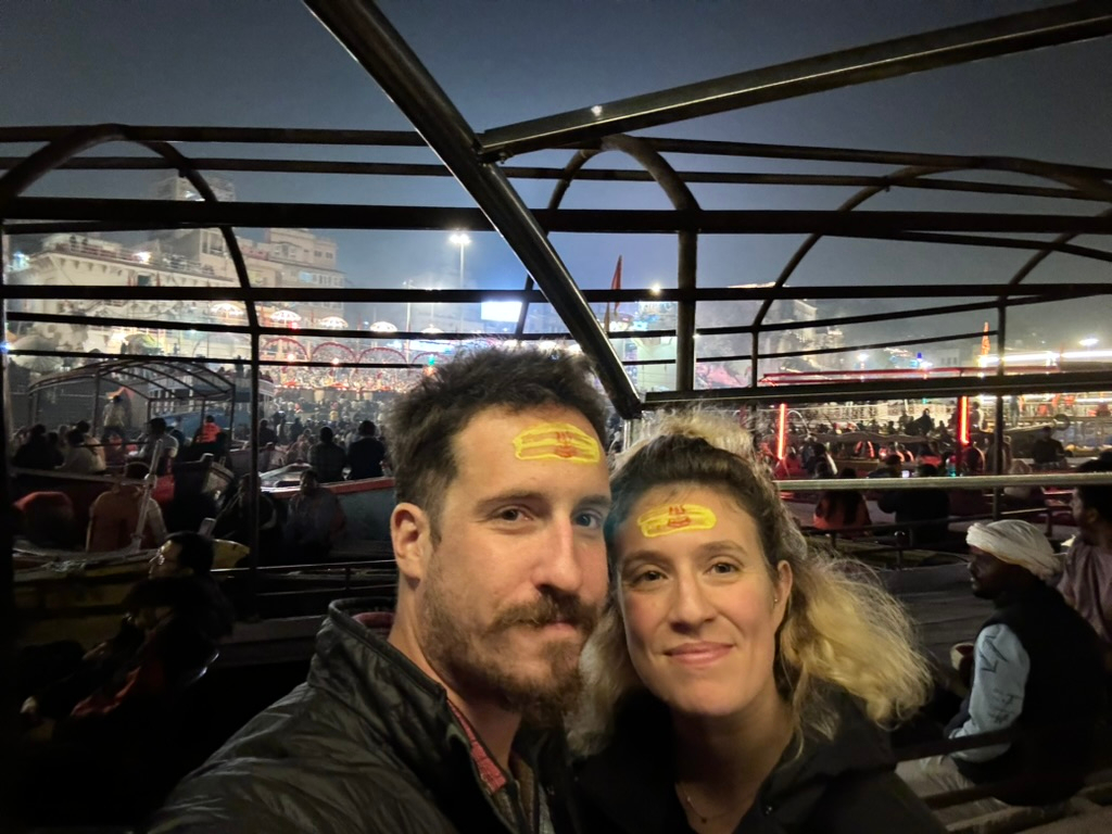 Couple enjoying evening aarti at Dashashwamedh Ghat in Varanasi, India