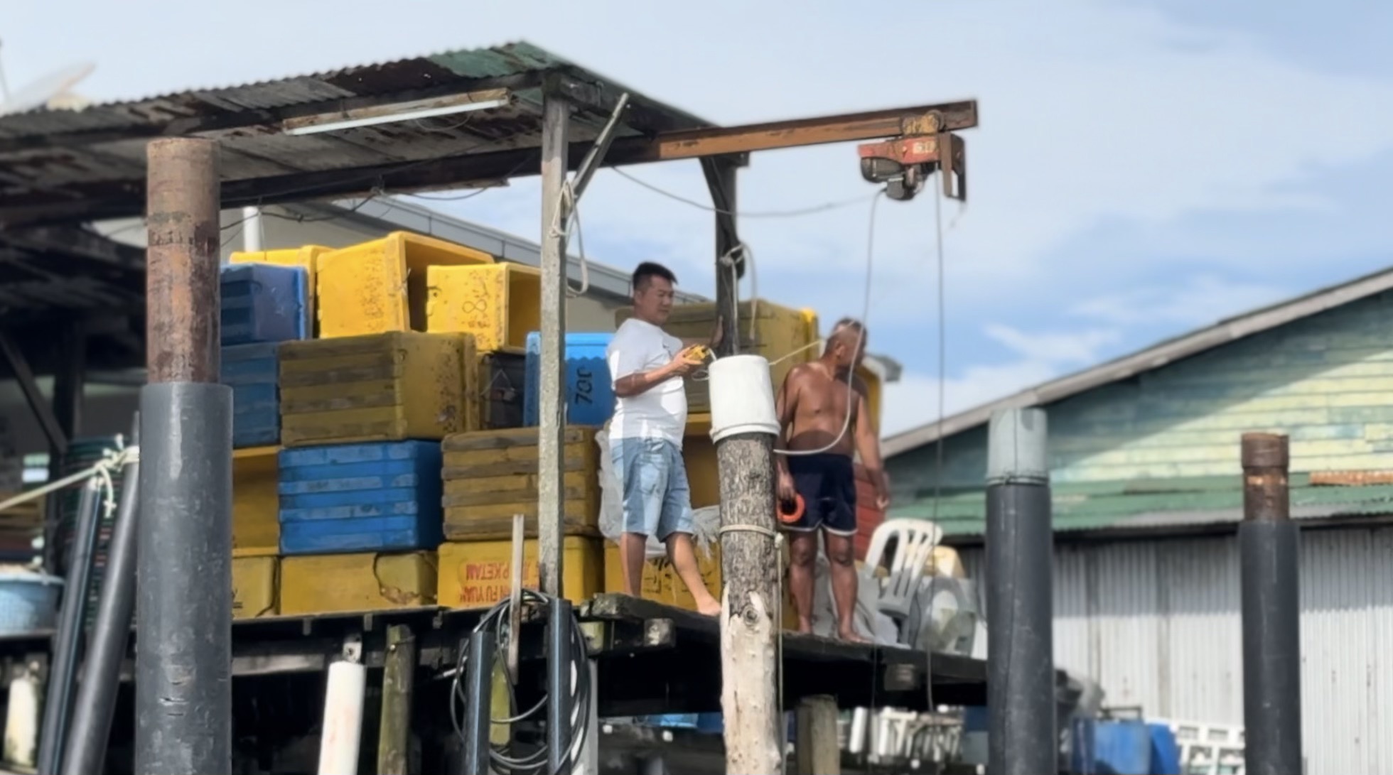 Man working on Crab Island, Malaysia