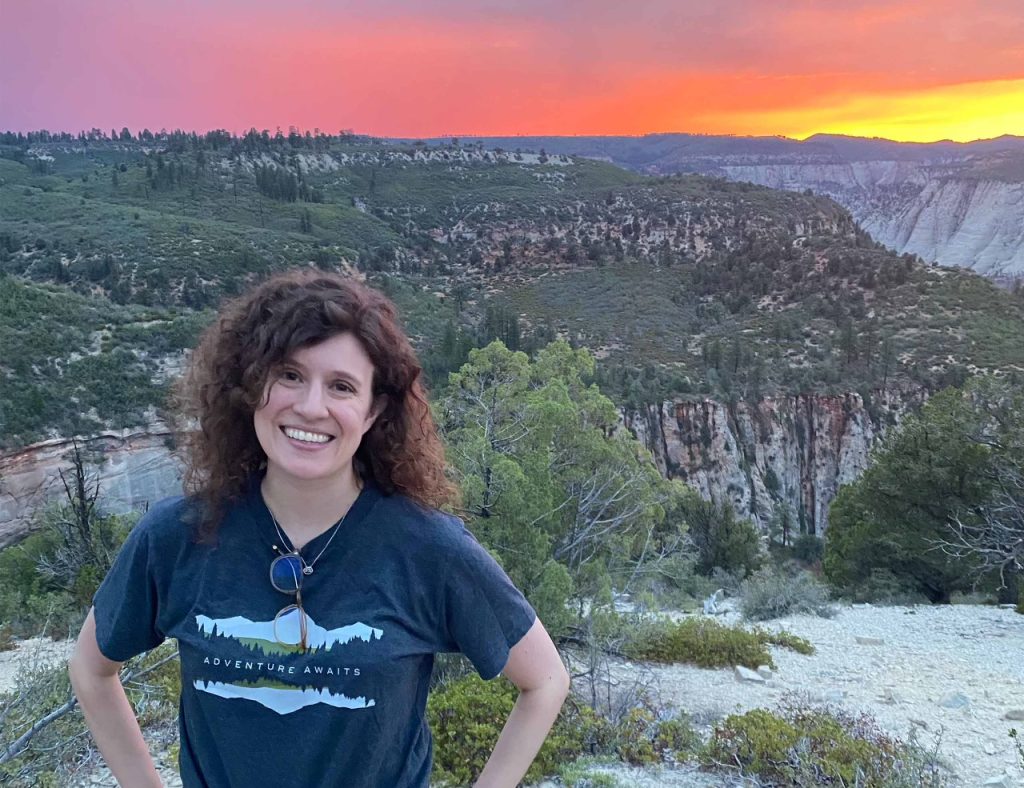 Woman in front of beautiful sunset in Zion National Park, Utah, USA