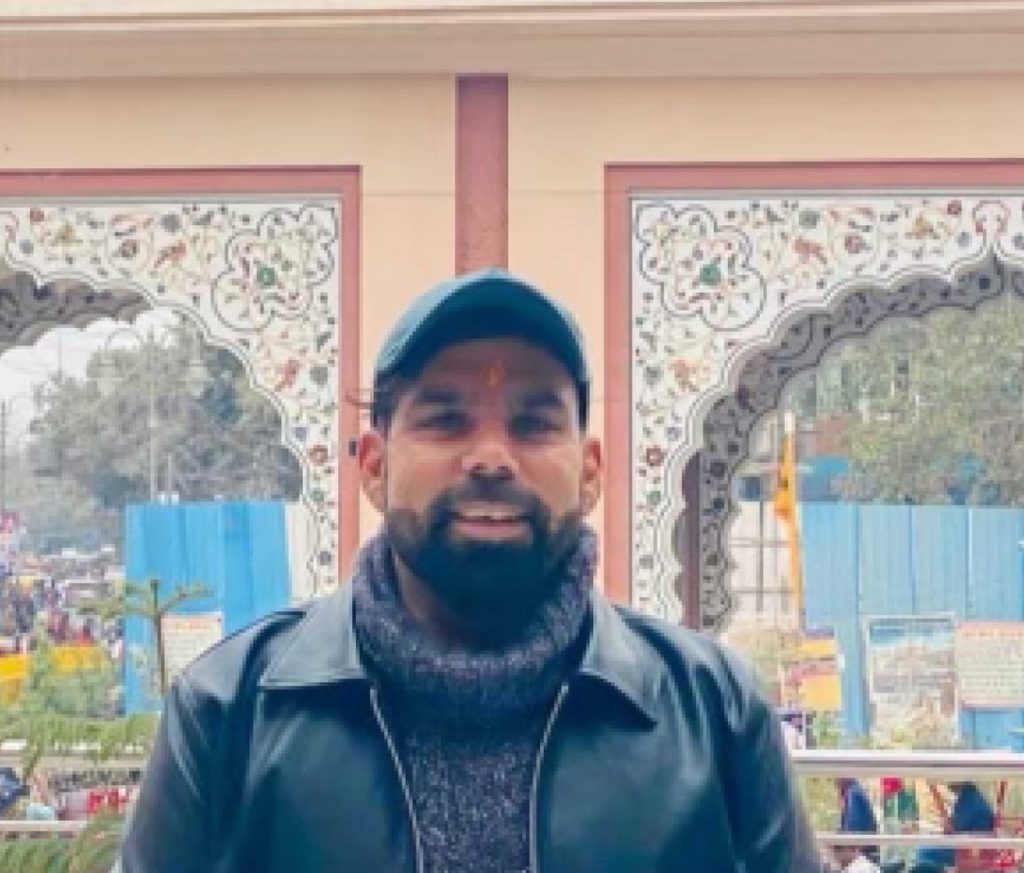 An Indian man with a baseball cap and a leather jacket in India