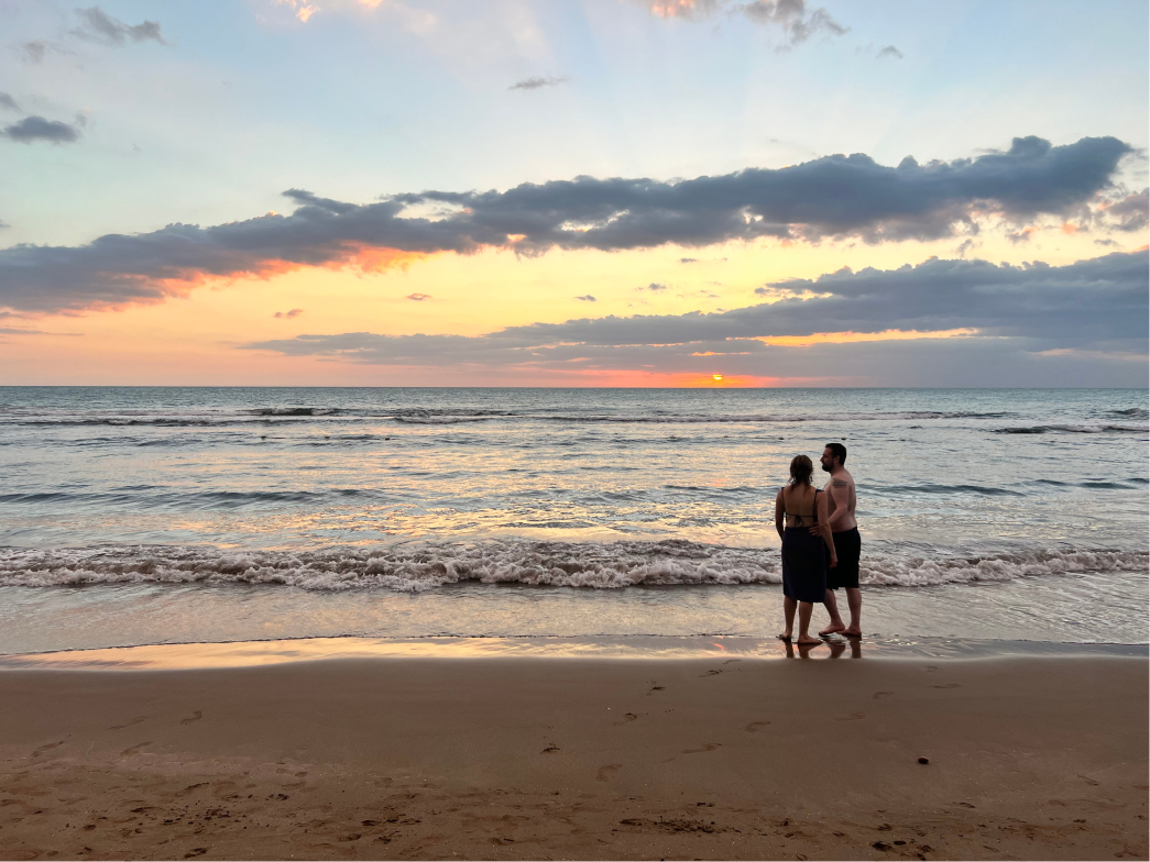 A couple enjoying a beautiful sunset in Treasure Beach, Jamaica