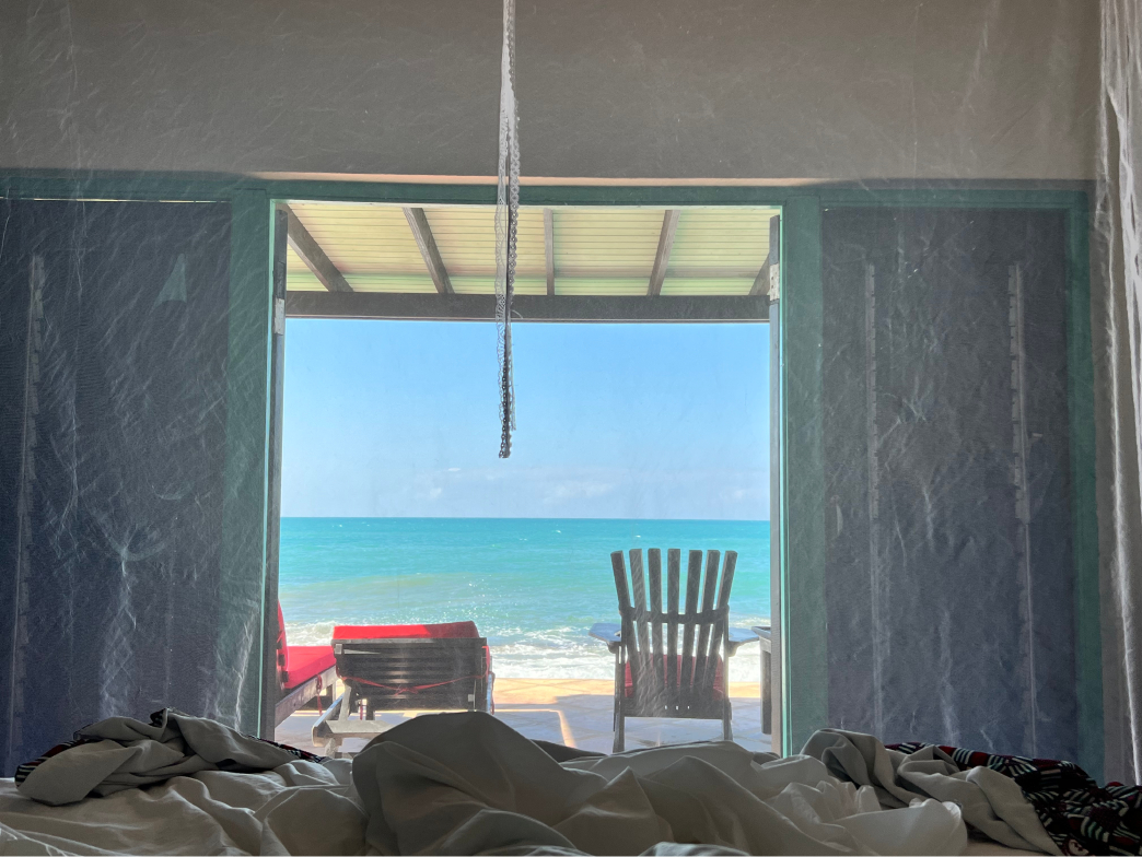 View of the ocean from inside an oceanfront villa at Jakes in Treasure Beach, Jamaica