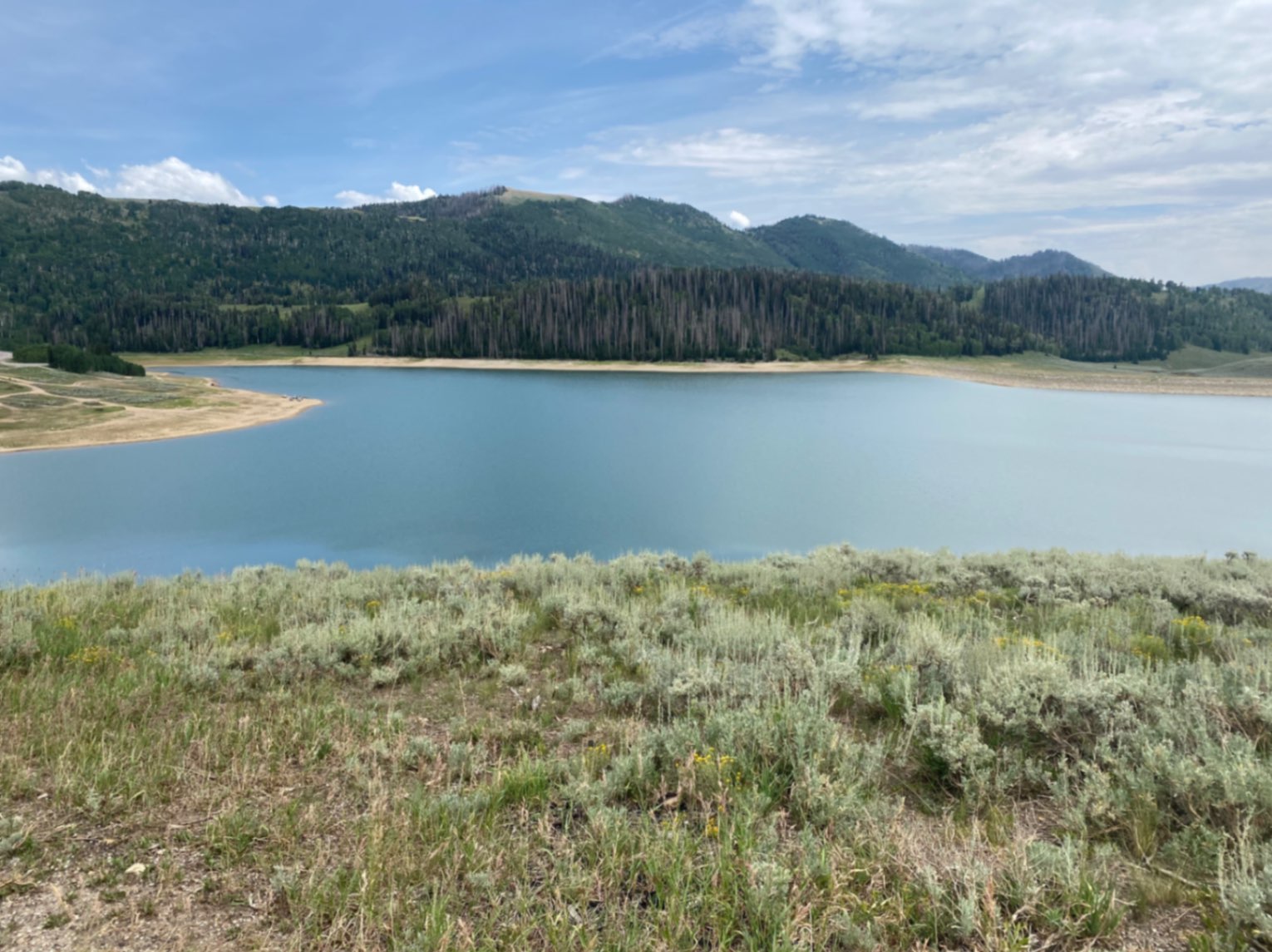 Glassy lake on scenic road in Utah, USA