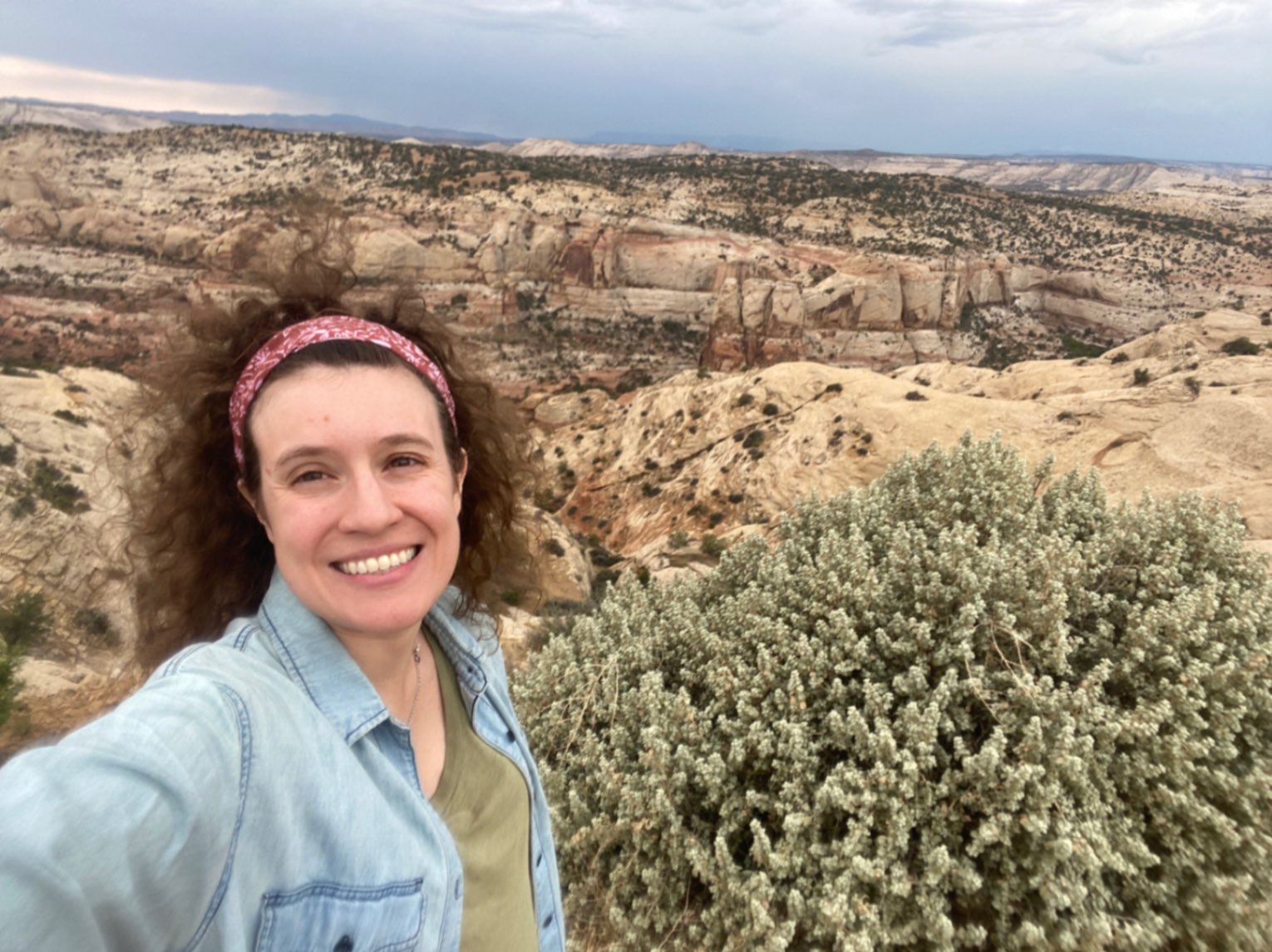 Woman in front of Grand Staircase-Escalante National Monument in Escalante, Utah, USA