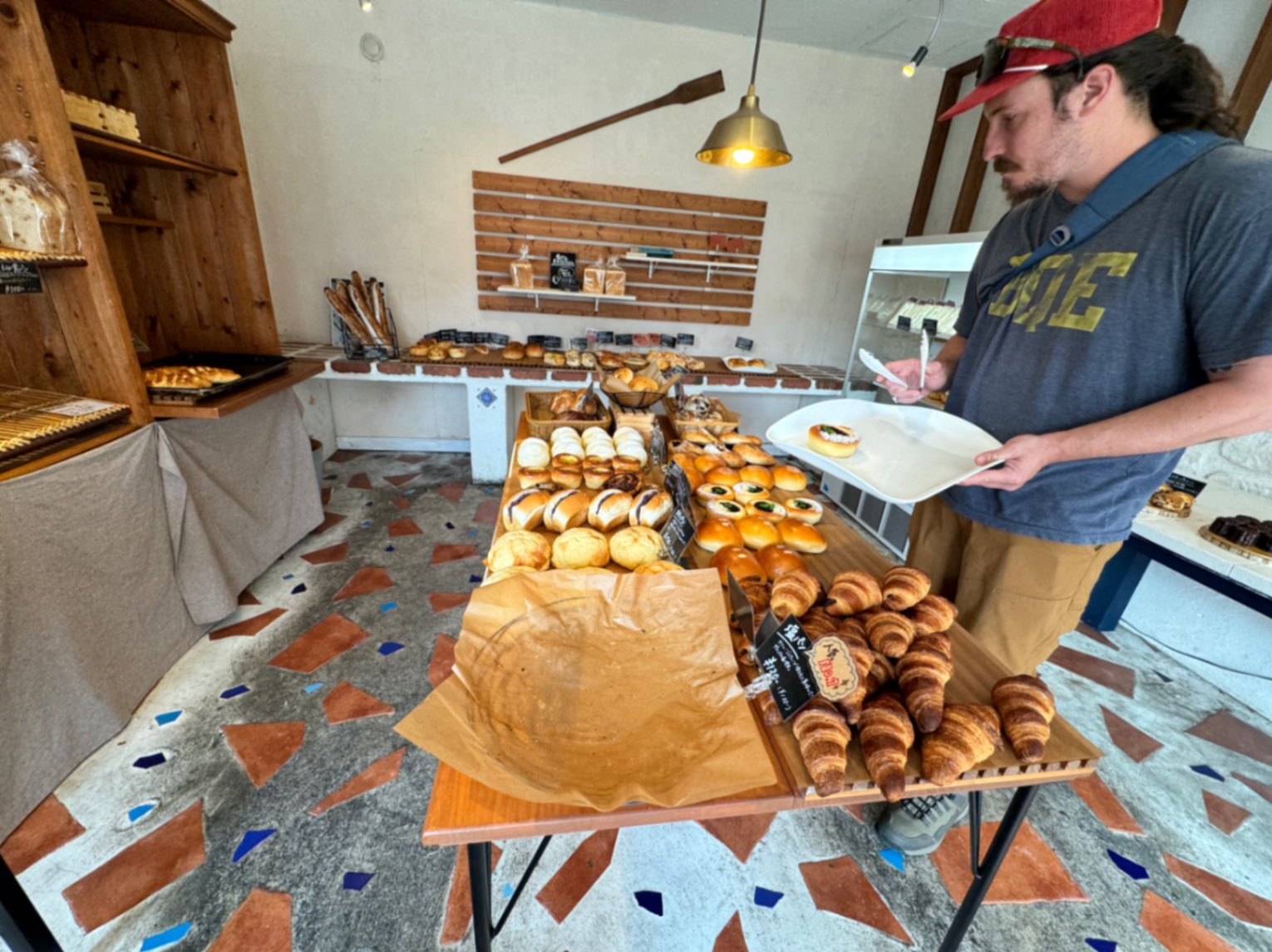 Man sampling baked goods at Bakery Ukigmo in Komatsu, Japan