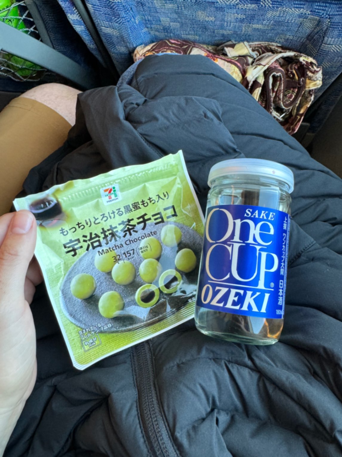 Matcha Chocolate and Ozeki One Cup Sake on train in Japan